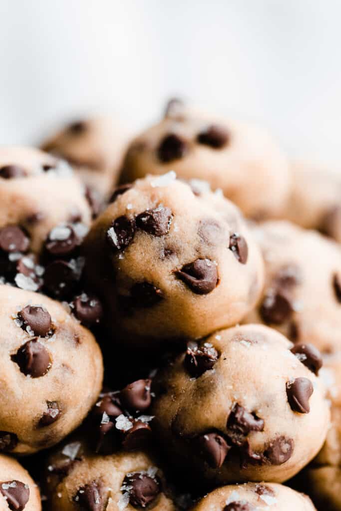 A close-up of no bake cookie dough balls in a vintage tray. 