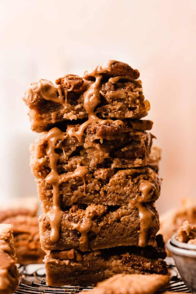 A tower of cookie buter blondies drizzled with more cookie butter.