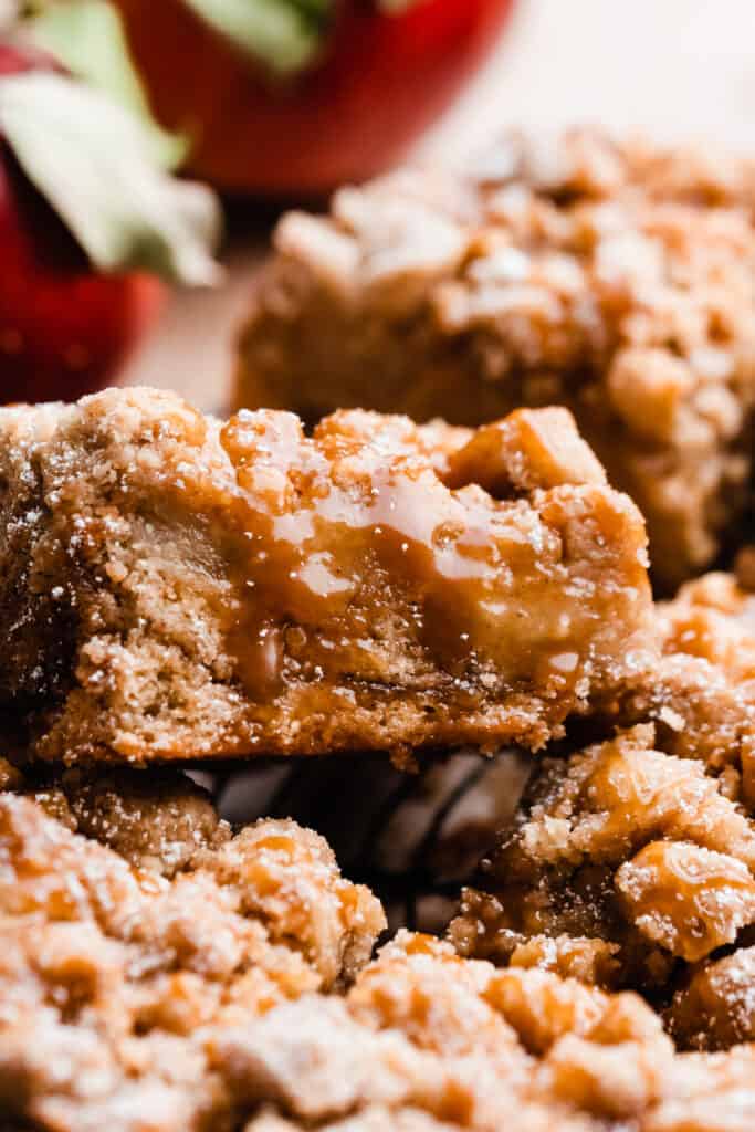 A close-up on a slice of caramel apple crumb cake.