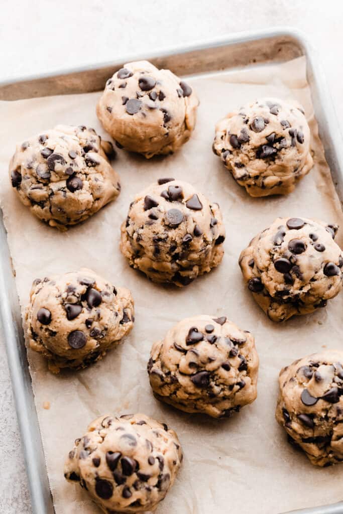 Cookie dough balls on a pan.