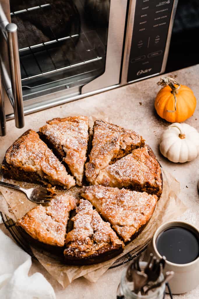 Sliced pumpkin gooey butter cake with the air fry oven in the background.