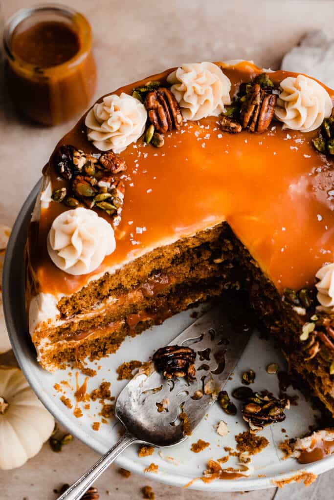 A top-down view of the sliced cake, with a beautiful layer of salted caramel sauce on top.
