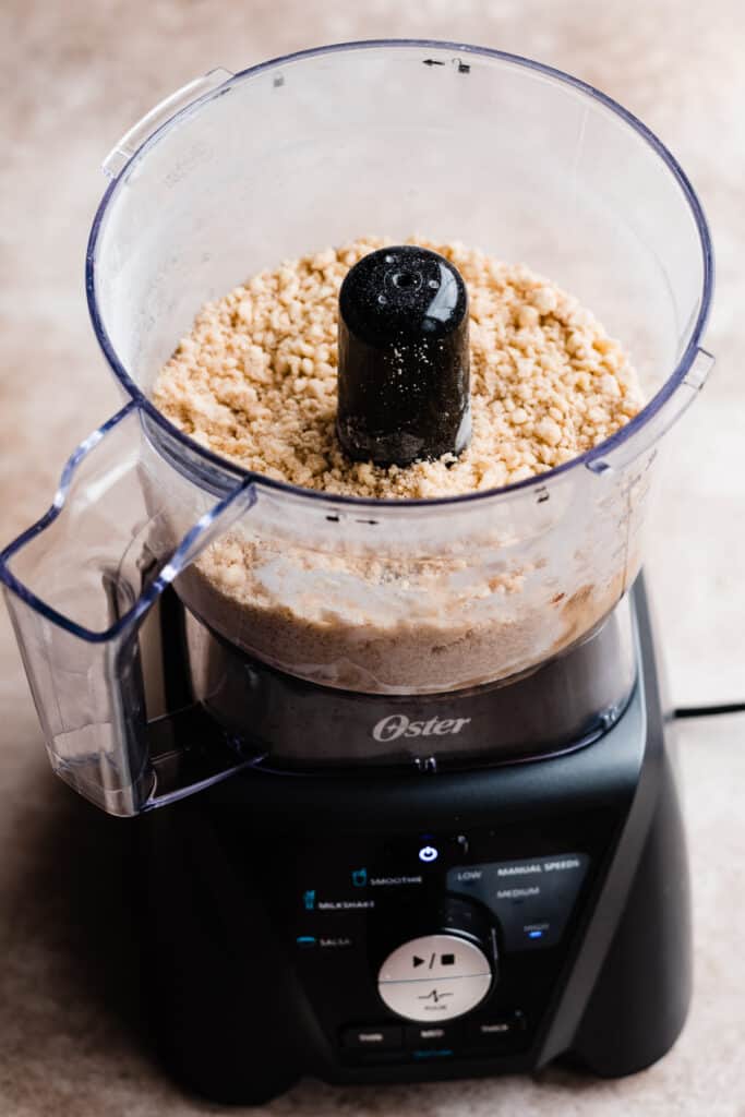 A food processor cup with the cinnamon streusel.