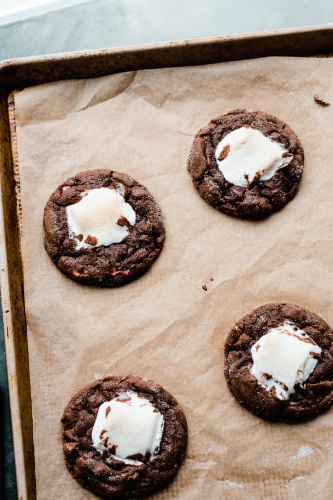 Baked hot cocoa cookies on the baking sheet.