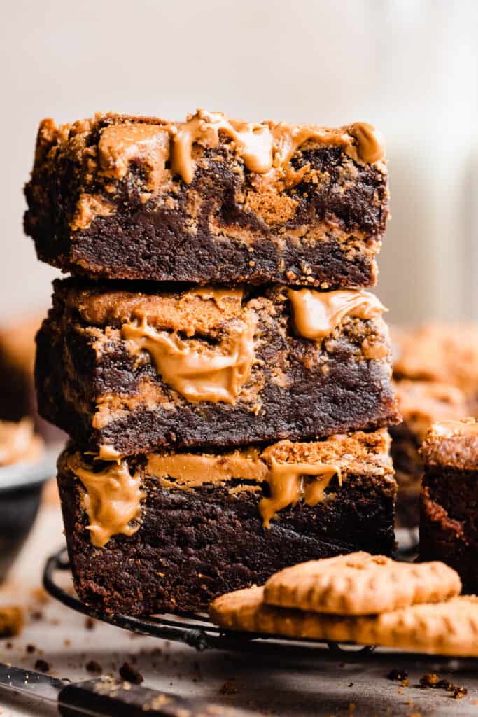 A stack of fudgy biscoff brownies with visible cookie butter swirls.
