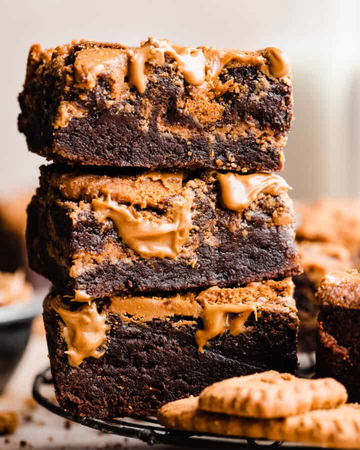 A stack of biscoff brownies with visible cookie butter swirls and fudgy texture.