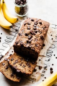 A sliced loaf of warm chocolate chip banana bread.