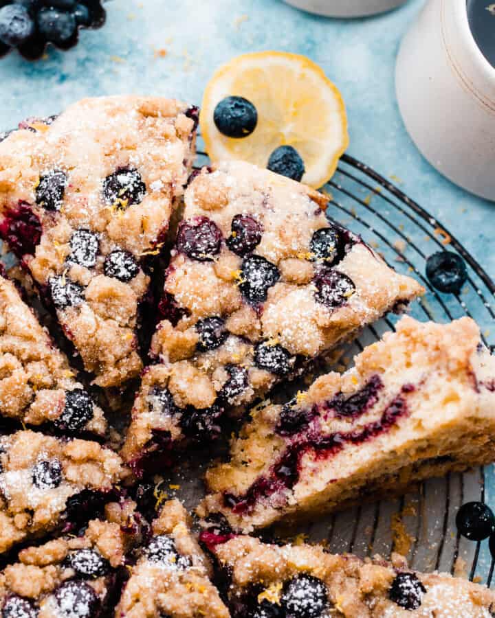 Slices of blueberry coffee cake on a vintage wire rack.