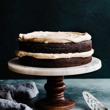 Guinness chocolate cake on a cake stand.