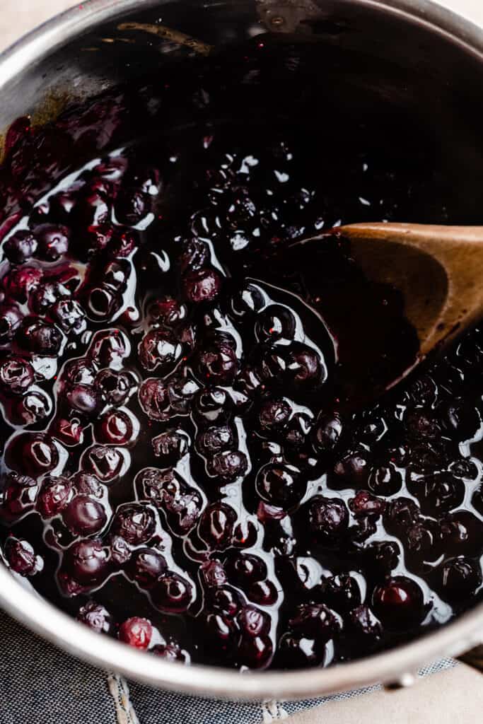 A pot of cooked blueberry sauce.