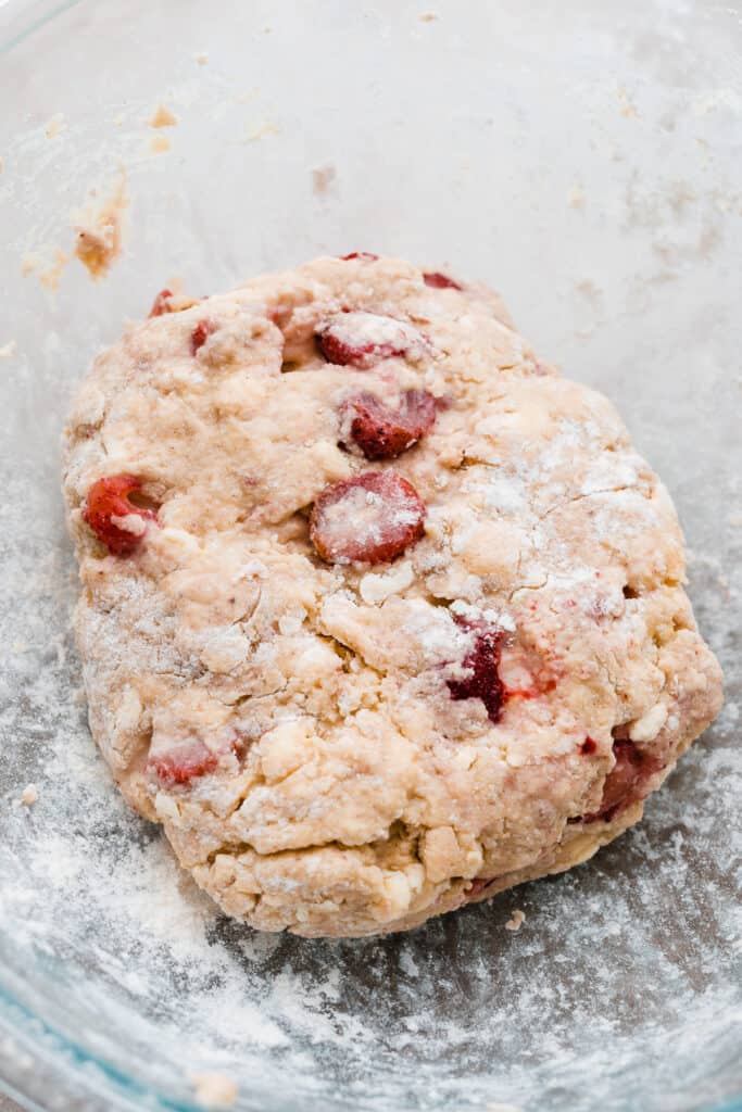 A bowl with the strawberry scone dough.