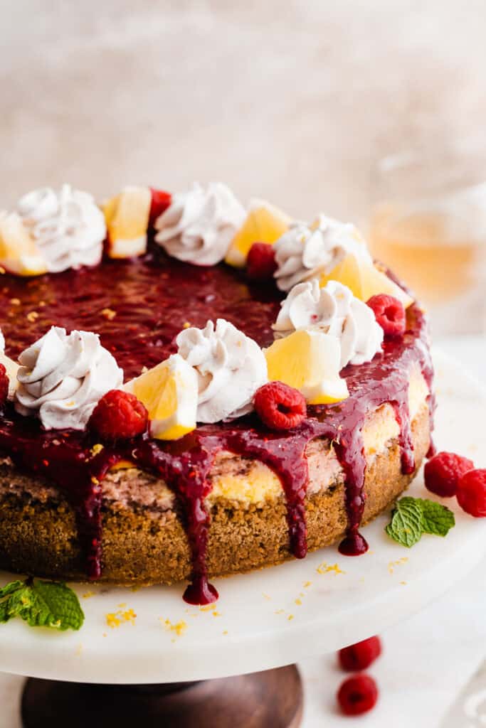 A raspberry sauce topped cheesecake.