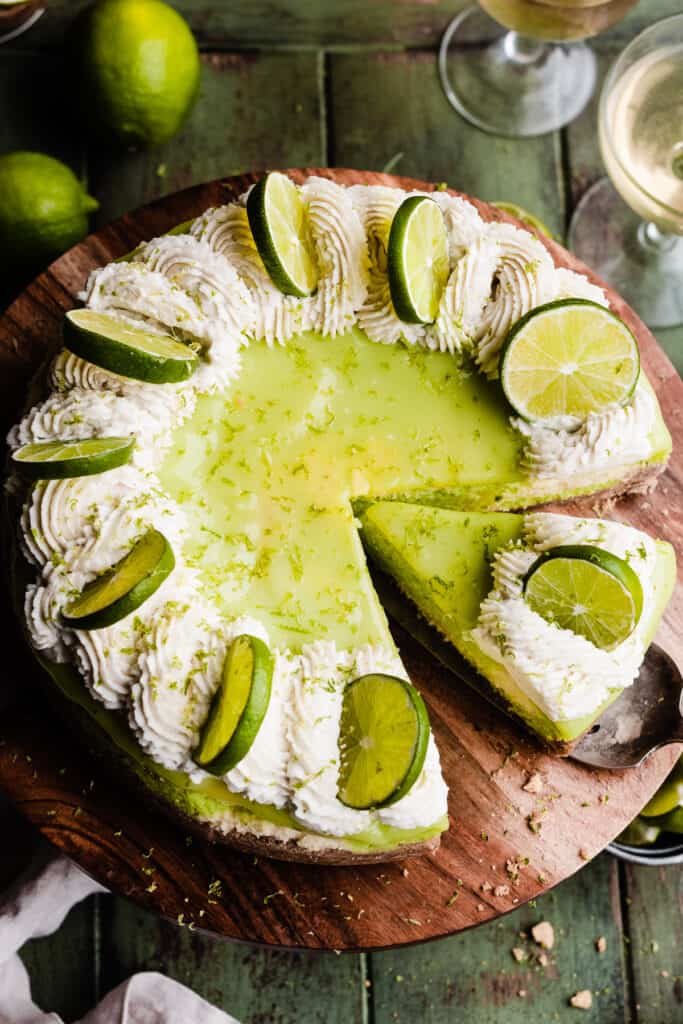A bird's eye view of a key lime pie cheesecake topped with lime curd.