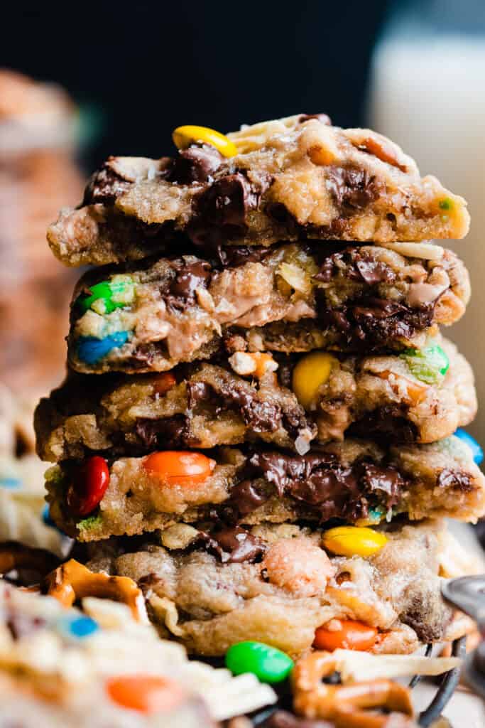 A stack of kitchen sink cookies, with the gooey insides showing.