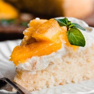 Mango cake on a dessert plate.