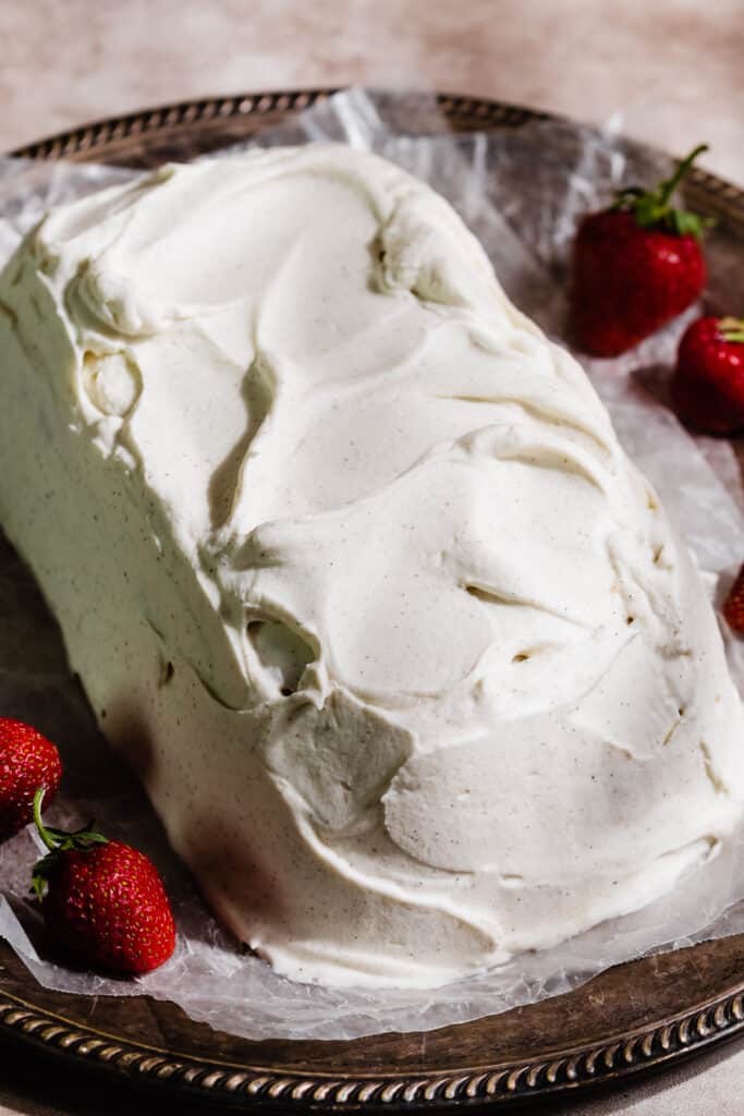 The icebox cake covered in additional whipped cream.
