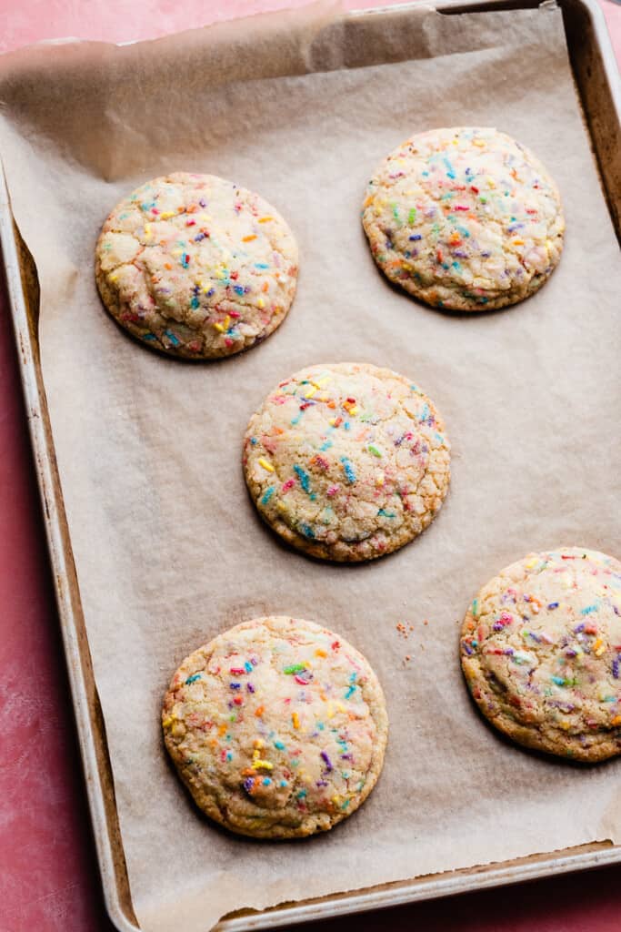 Baked funfetti cookies on the baking sheet.