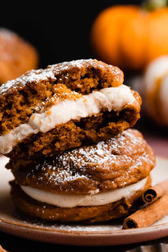 A close-up of half of a pumpkin whoopie pie, showing the fluffy insides.