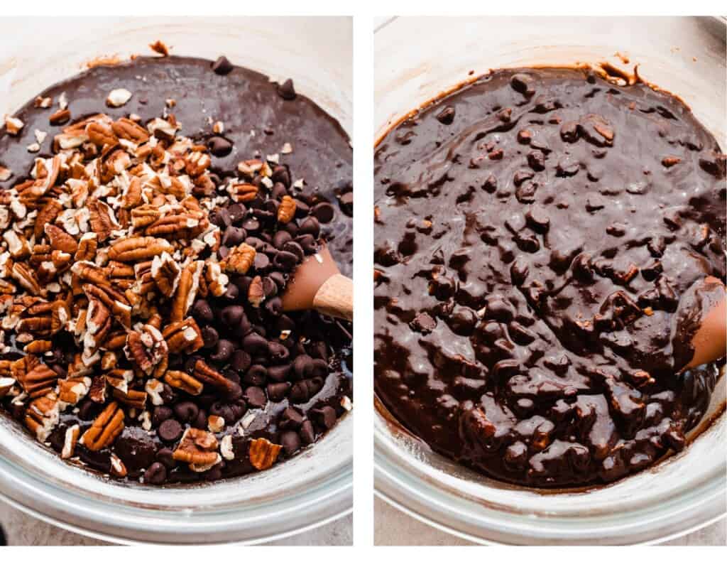 A bowl of brownie batter with chocolate chips and pecans being mixed in.