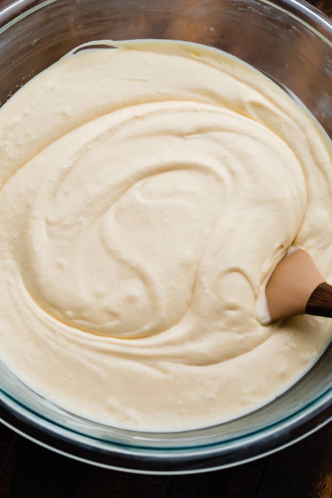 A bowl of the plain, creamy cheesecake batter.