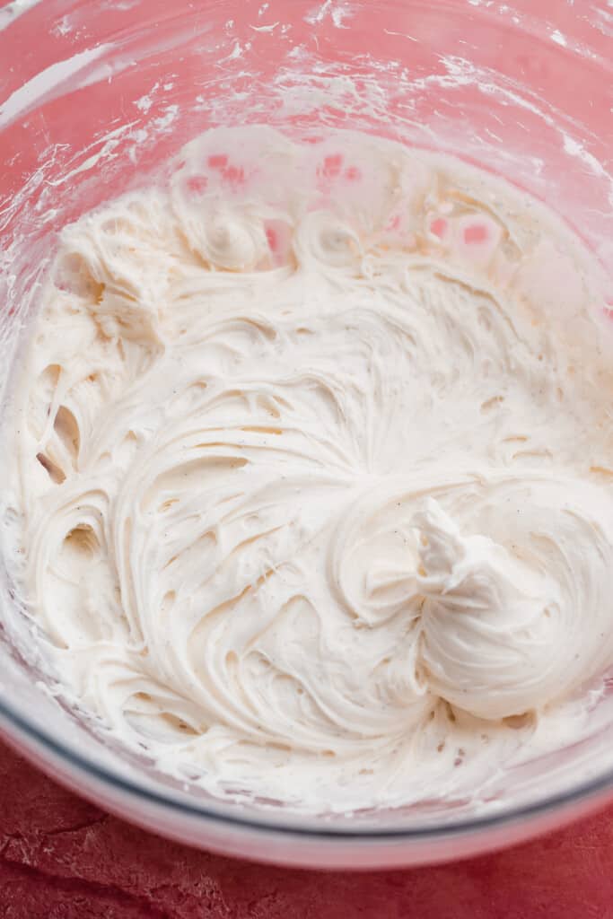 A bowl of cream cheese frosting. 