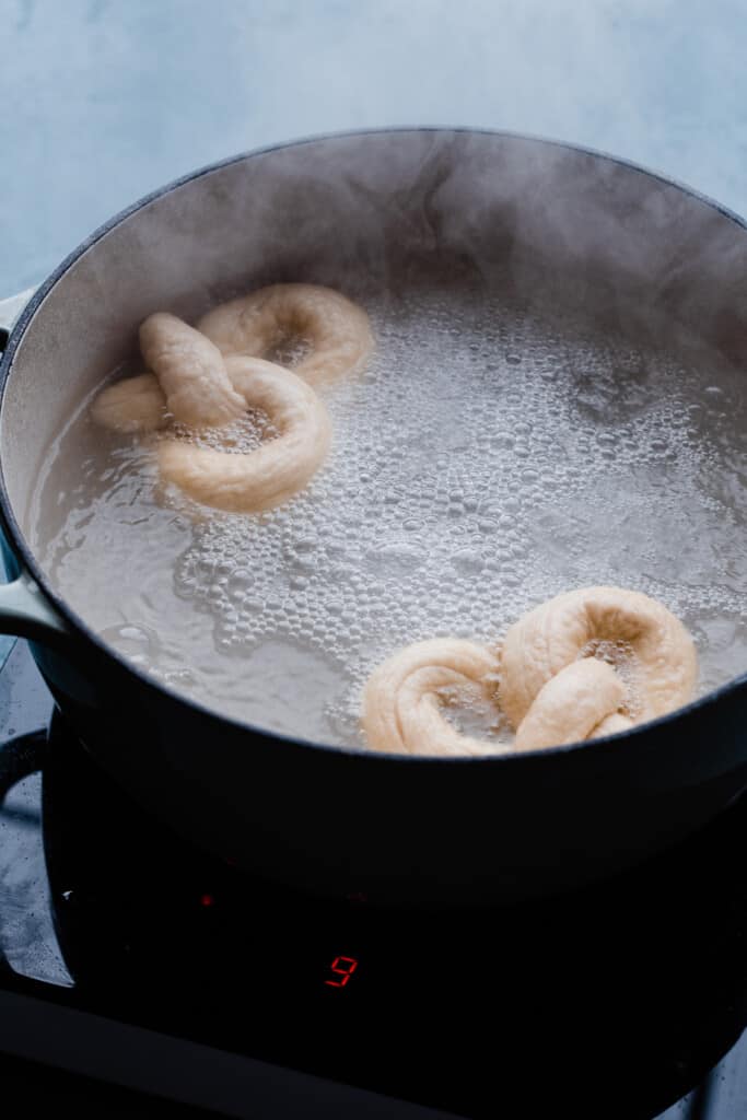 The twists of dough in a baking soda bath.