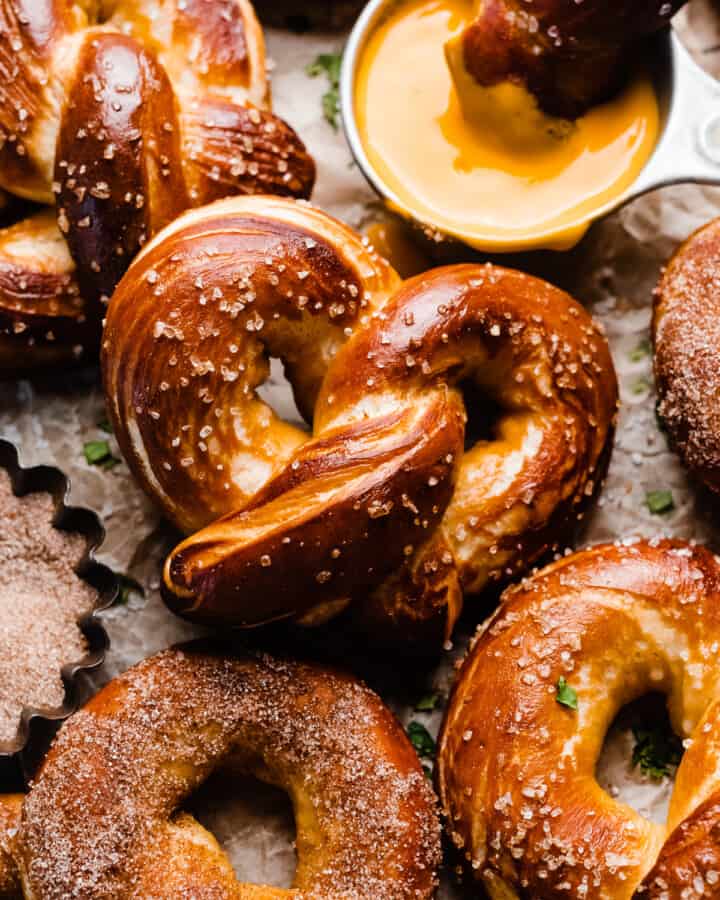 The golden brown, baked pretzels on a vintage wire rack.
