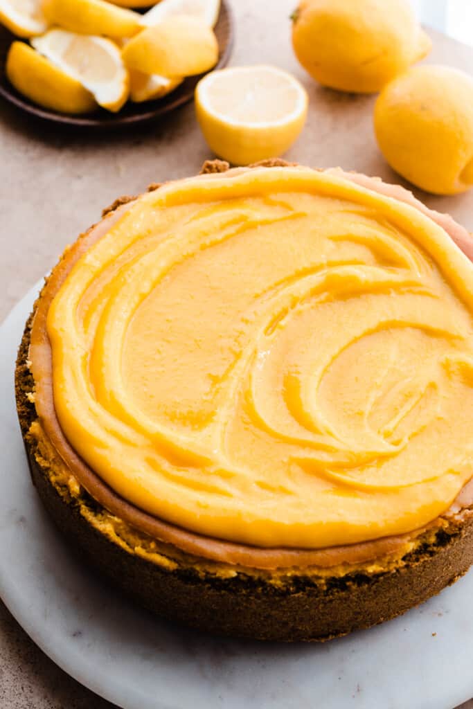 The baked cheesecake topped with lemon curd.