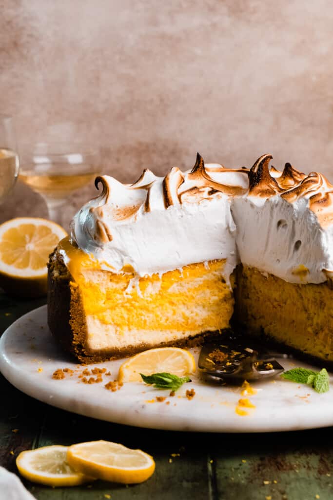 The sliced lemon meringue pie cheesecake, showing the layered insides. 