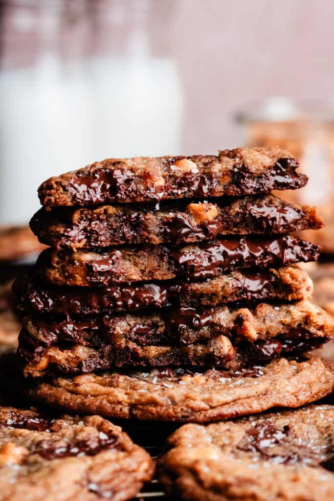 A stack of butterscotch chocolate chip cookie halves, showing the chewy centers.
