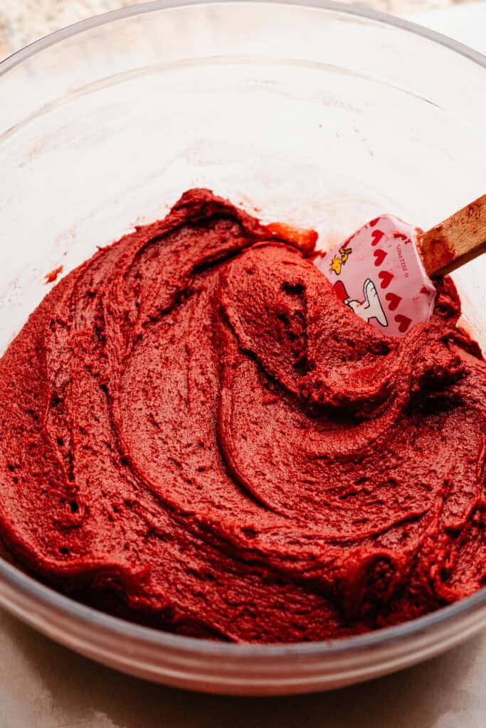 A bowl of red velvet cookie dough.