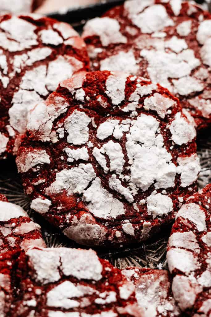 A close-up on a red velvet lava cookie, with all the beautiful powdered sugar crinkles visible.
