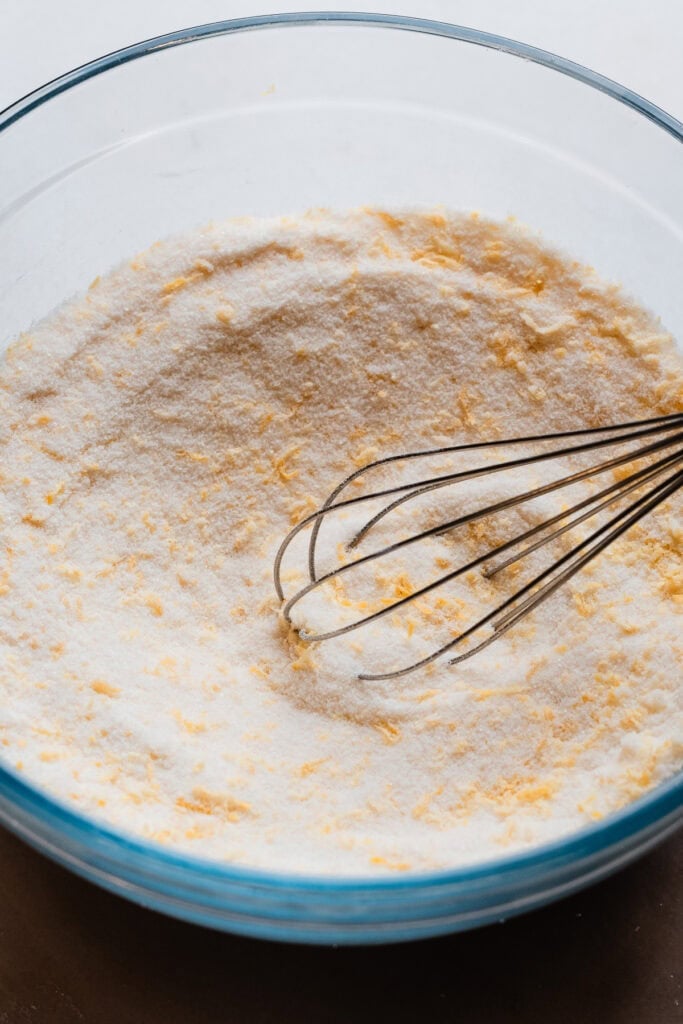 A bowl of the lemon zested sugar and flour, whisked together.