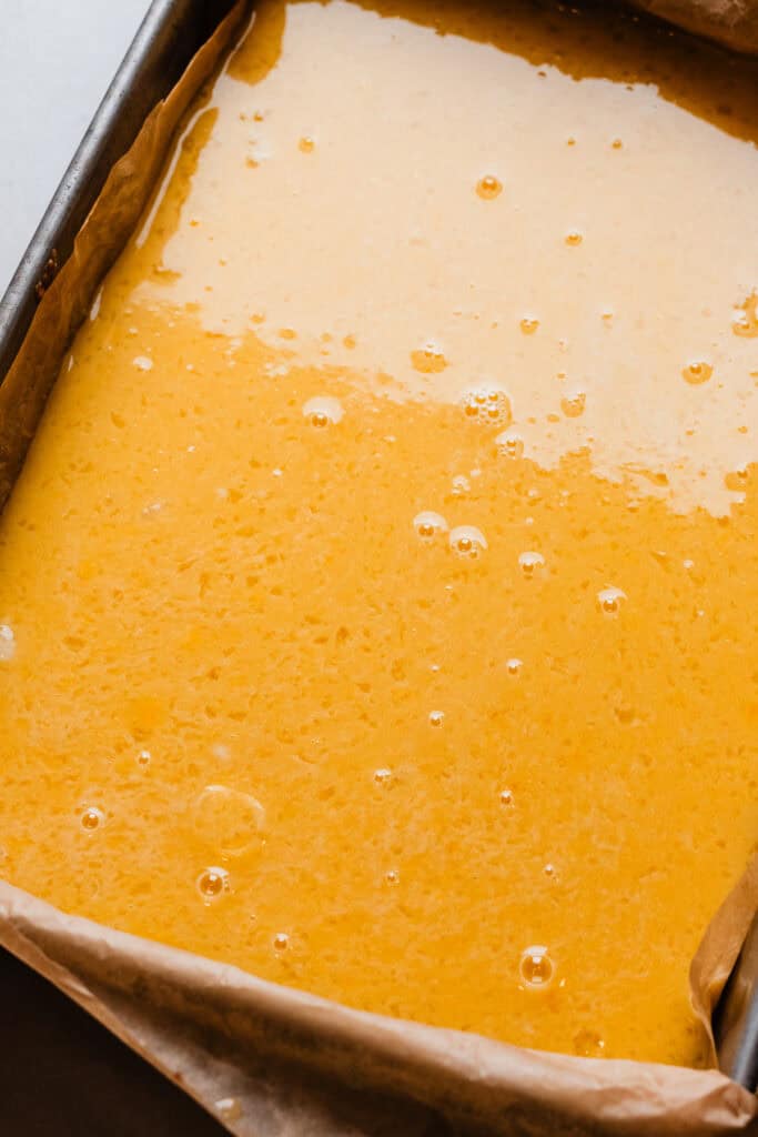 A pan of the lemon bars, ready to be baked.